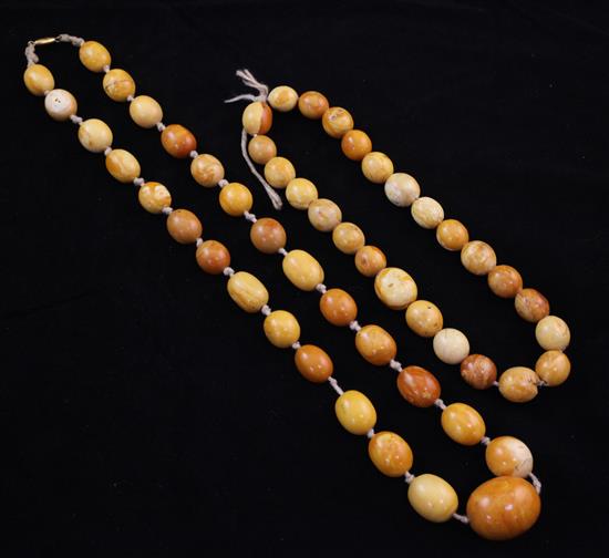 A single strand amber bead necklace and similar bracelet, gross weight 65 grams.